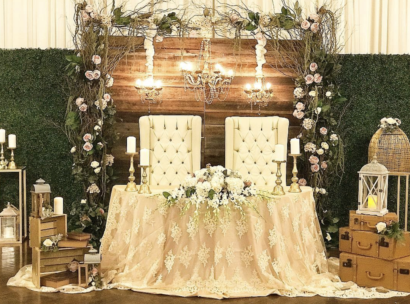 Vintage Decor Wedding Tips, a lace covered ceremony table with flowers, candles, wooden crates and a flower wall back drop